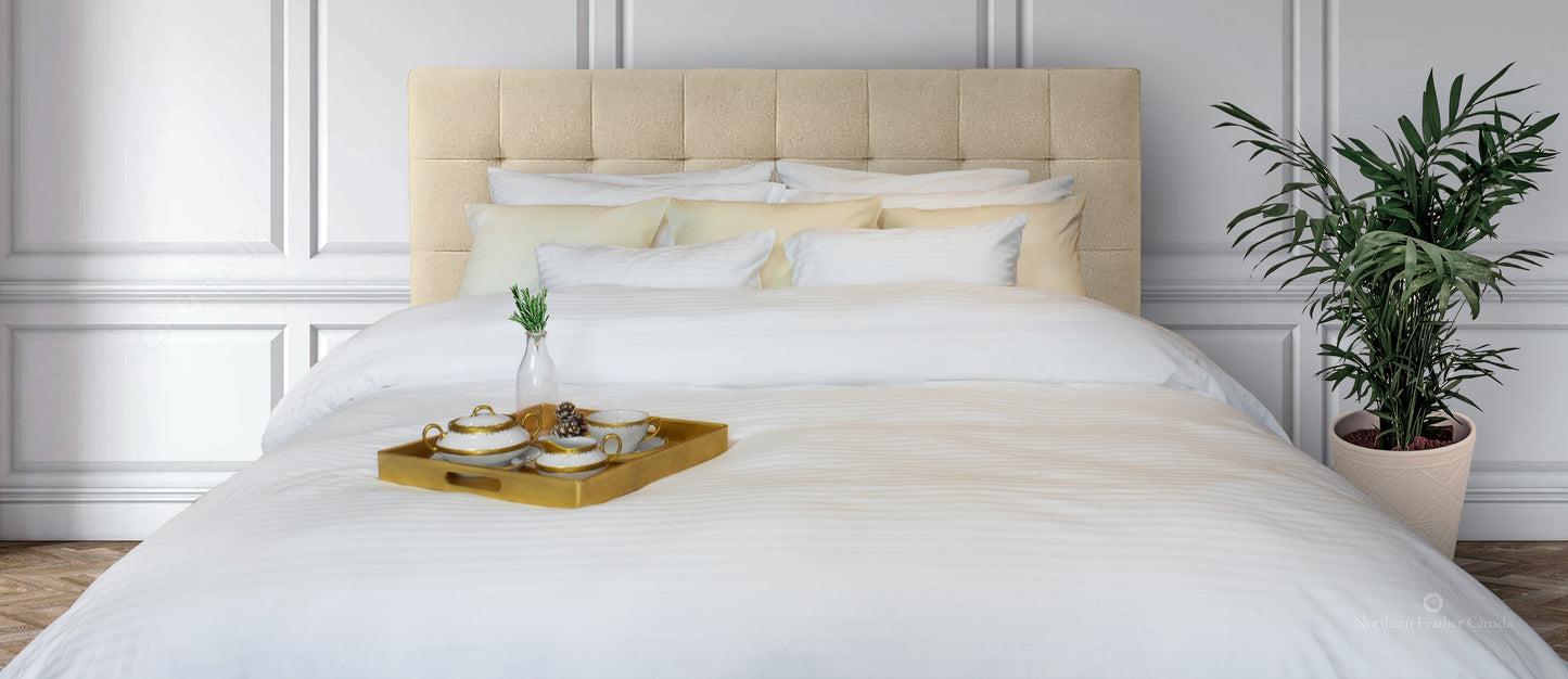 straight on photos of bed made up with Damask Bed linens. 4 regular pillows and 5 Boudoir cushions. Gold servering tray sitting on the foot of the bed with white and gold porcelain tea set