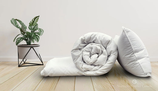 rolled White Down Duvet (fill level 2) with White Down Pillow (medium fill level)